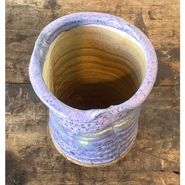 This evocative vintage studio art pottery vase is a masterclass in texture and color, perfectly capturing the organic...