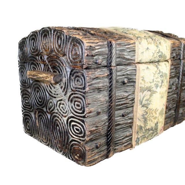Antique Black Forest Carved stacked Logs Trunk with upholstery. Floral tapestry center wrap. Early 20th century. 15 1/4" H...