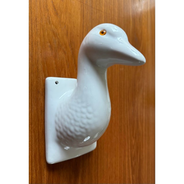 Vintage mid 20th century white ceramic wall mounted goose head hook or decor. Fun and whimsical addition to your home!