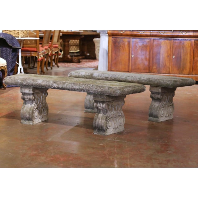 Substantial and beautifully weathered, this pair of early 20th century French garden benches offers sculptural form and...