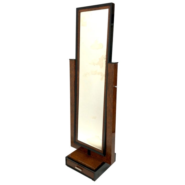 The mirror is completely original, the wood was merely fresh shellac Hand Polished.