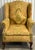 A classic silhouette with a wingback design and rolled, flared arms. Features ornate tapestry pattern in tones of gold,...