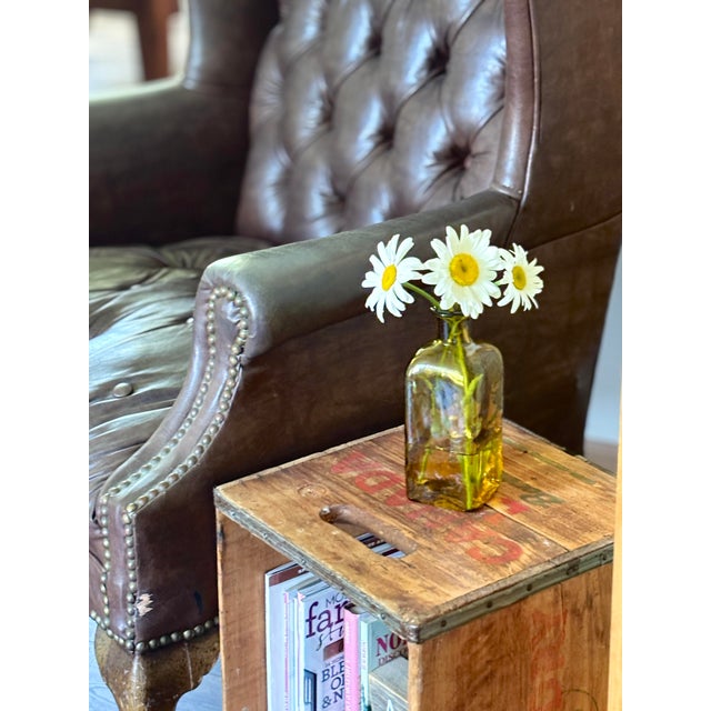 Mid-century hand blown glass apothecary jar in the style of vintage Empoli, Italy. Features a square-bodied form with a...