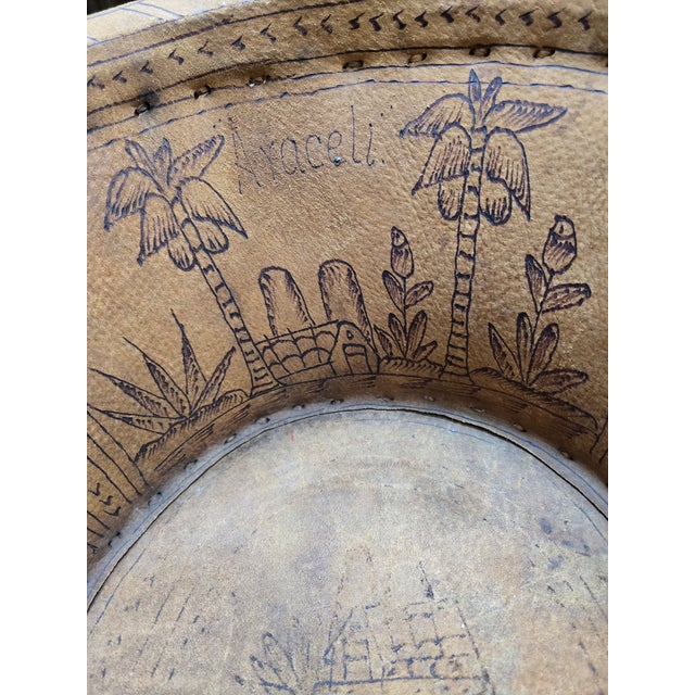 A captivating vintage mid-20th-century child-sized Mexican Equipal barrel chair. Hand-constructed using traditional...