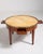 A refined bouillotte table inspired by Louis XVI design, featuring a marble top and brass detailing. Originally used for...