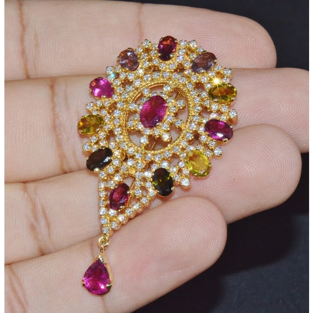 Top quality pendant / brooch loaded with gorgeous natural multi color tourmalines and diamonds in a gorgeous floral...