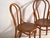 A set of two antique chairs in bentwood, with a closed hoop back with an inner loop and a moulded board seat. Originates...