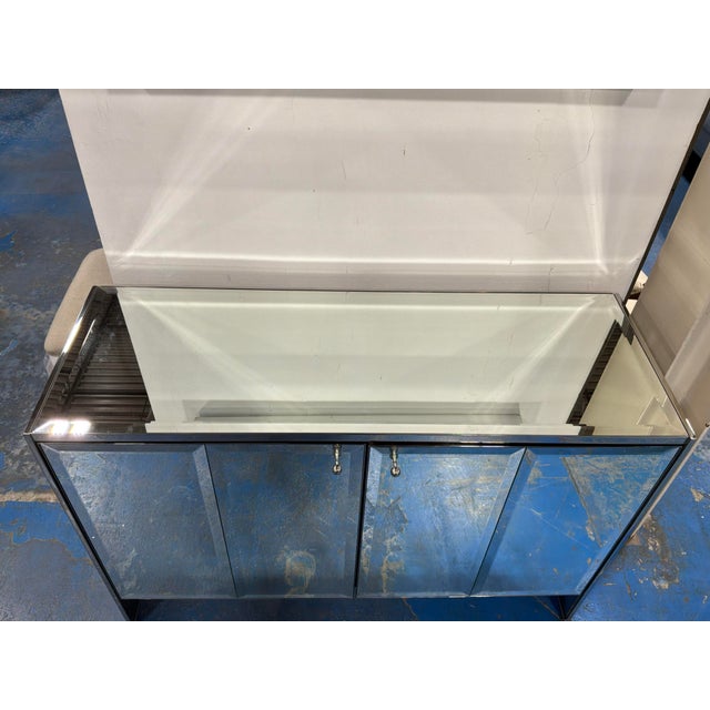 Elegant Baker Luxe Collection Mode Console. Mirrored design, 2 doors with shelves on the inside. Original Retail $11,997....