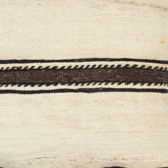 Add a touch of history and warmth to your space with this vintage handmade Turkish wool kilim cushion cover. Crafted from...