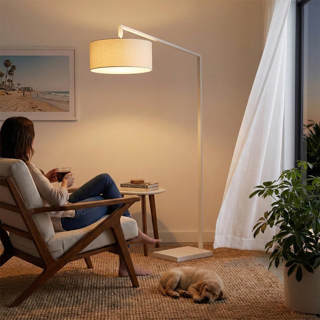 The Stretch Arc Lamp is a modern design by Kirby Groce, featuring a striking architectural silhouette that serves as a...