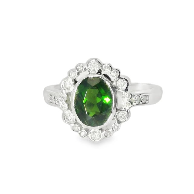 Add a touch of vibrant elegance to your collection with this stunning 14K White Gold Green Tourmaline and Diamond Ring....