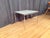 MDF Italia coffee table. In very good original condition. Excellent craftsmanship in polished steel and agglomerated...