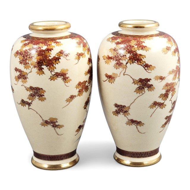 A well-balanced pair of Kyoto Satsuma vases from the late Meiji period, painted with serene river landscapes. Maple...