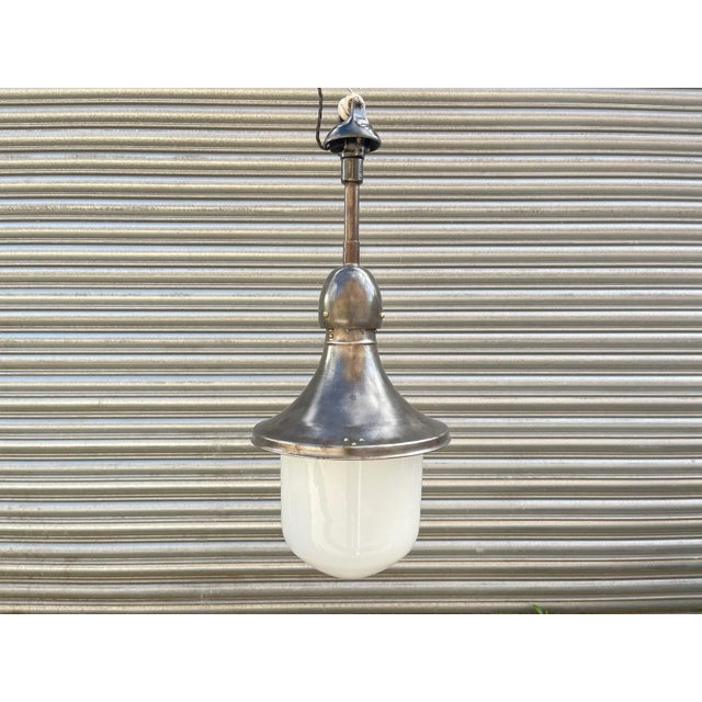1930s industrial pendant light by kandem - körting & mathiesen leipzig. dark steel & enamel build with white opaline glass...