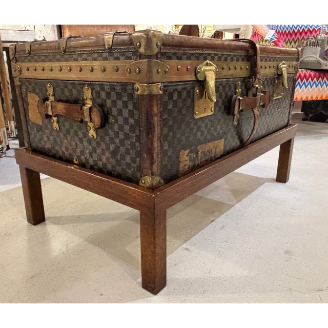 An extraordinary early 20th-century French Moynat steamer trunk, beautifully reimagined as a coffee table. This rare piece...