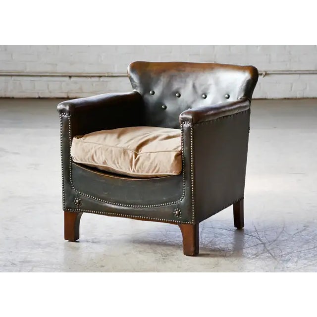 Charming small scale Danish club chair made around the 1930's to 1940's. The Danes called these smaller type chairs...