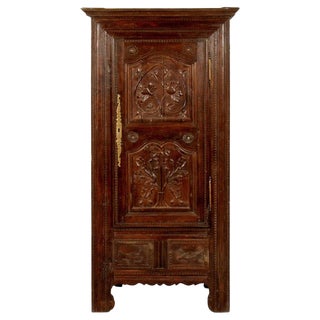 A French Oak Bonnetiere With Carved Door, Early 19th Century For Sale