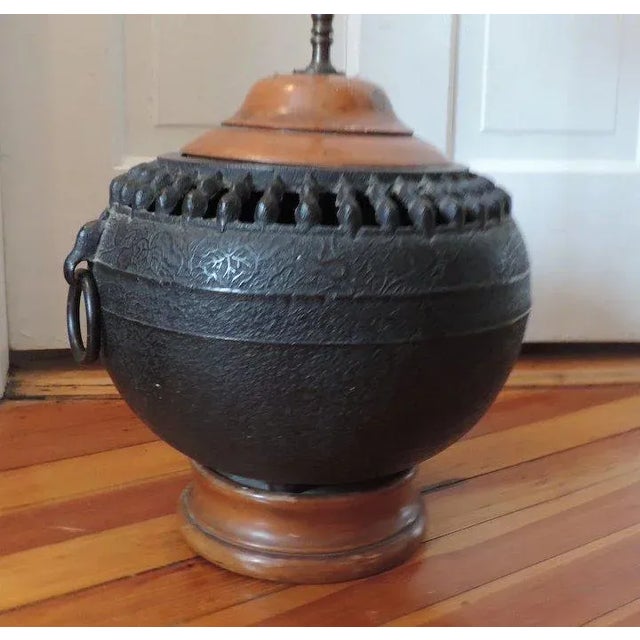An exceptional 19th century bulbous censer vase cast with pierced gallery, loose ring handles and overall relief...