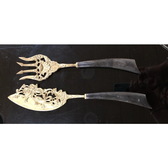 Embossed Brass Very Ornate Fish Servers. Asian inspired koi fish, trident and shell designs adorn this unique serving...