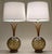 A brilliant and striking pair of Large Mid Century Tiki Modern styled blown Amber colored glass globes with Walnut wood...