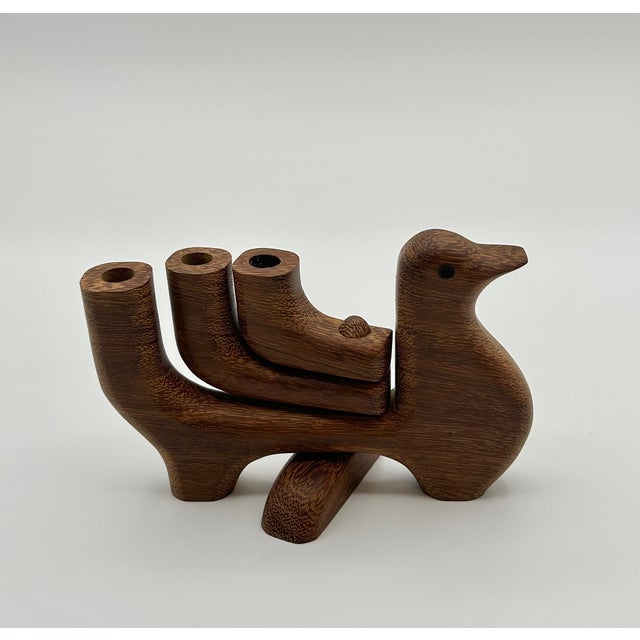 Handmade dove candelabra from Mexico. Made of sustainable wood. Fits three small candle tapers.