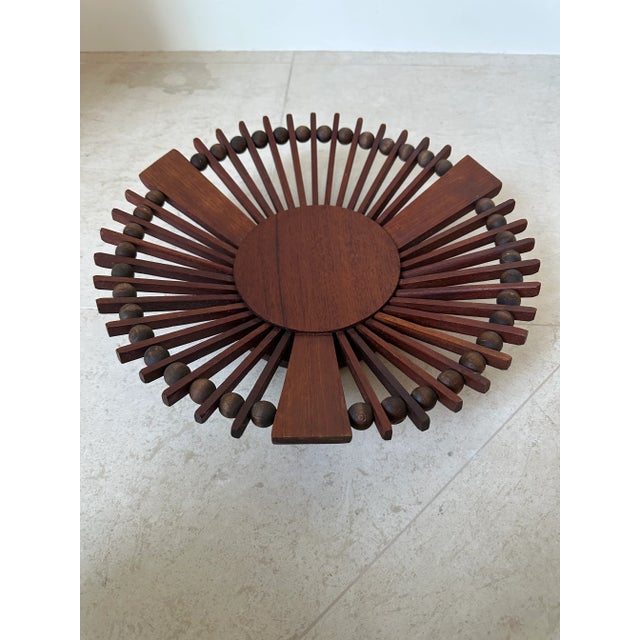 Fabulous handcrafted Mid-century wood vessel, dating to the 1980’s. A centerpiece, plinth and three carved arms provide...