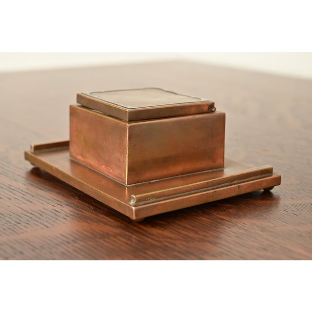 A beautiful Arts & Crafts period sterling silver on bronze inkwell By Silver Crest (the mark of Smith Metal Arts Co.), an...
