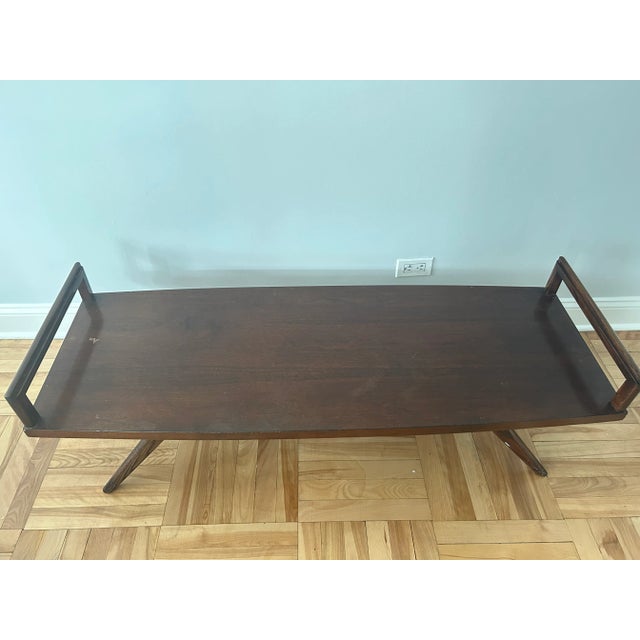 This vintage 1950's mid-century modern coffee table creates the perfect statement piece in any living room. With iconic...