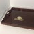 VINTAGE HOME is pleased to offer a Mid Century Modern Serving Tray. It features three brass seashell inlays in the lower...