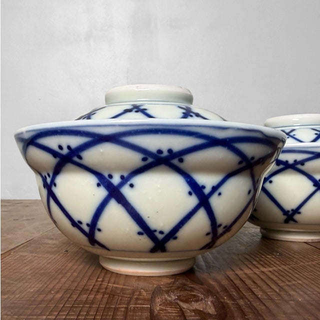 Atmospheric set of five Japanese porcelain bowls with lids – the classic type of lidded wan known in Japan as futamono....