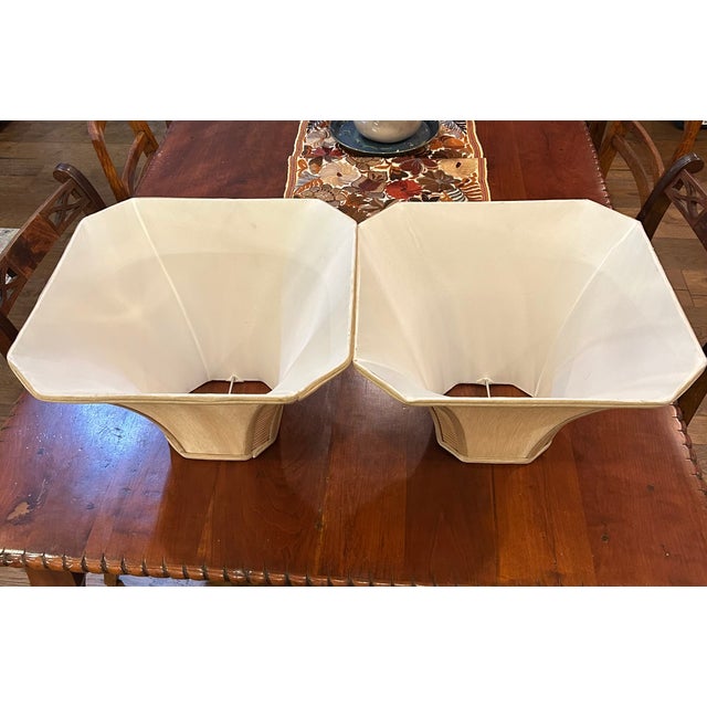 : Elegant pair of silk lamp shades measuring 15” wide x 10” tall. Crafted in luxurious silk and presented in excellent...
