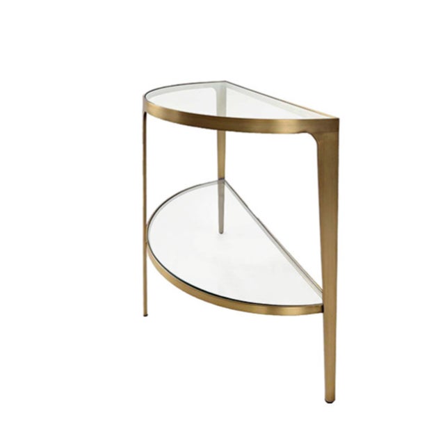 New special order item. Not vintage. Elegant two-tier demilune console table featuring a striking antique brass frame and...