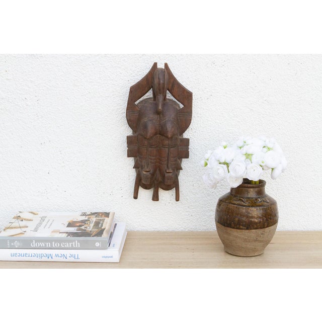 This charming Kwele mask from Gabon or the Republic of Congo is a delightful example of African tribal art. The surface is...