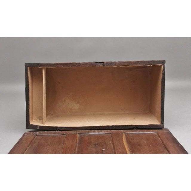 Early 18th Century oak coffer with the hinged three panelled top opening to reveal a large compartment space, the three...