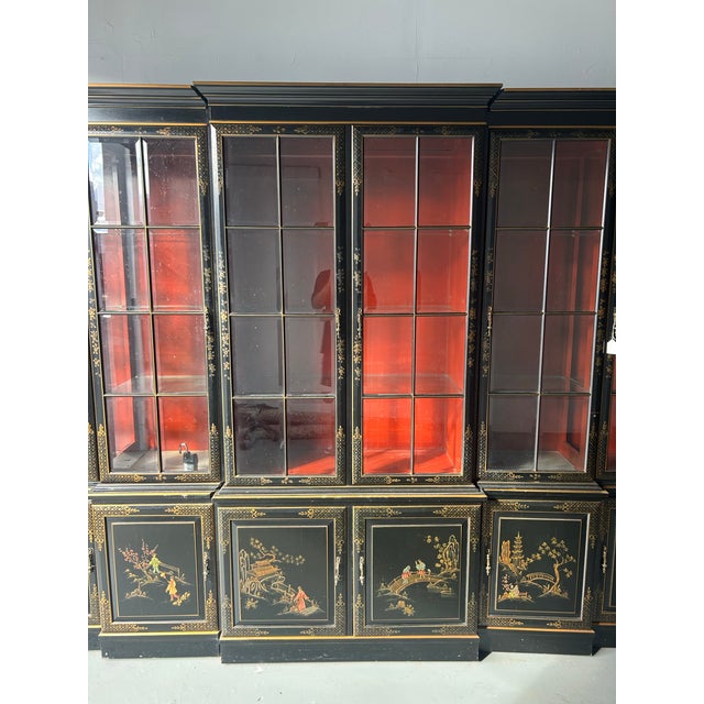Make a statement with this stunning black lacquered chinoiserie breakfront china cabinet. Featuring intricate hand-painted...