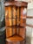 The purpose of this 1940s corner cabinet displays favorite items as well as stores necessities for easy access in...