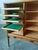 Sideboard made of teak wood, with two sliding doors, eight shelves, and two trays, Denmark, 1970s. Dimensions: Height...