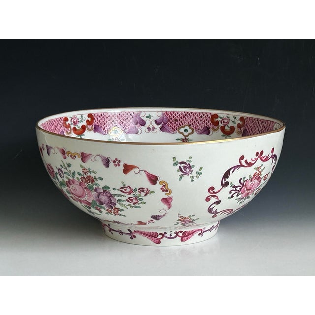 Mid-18th century English soft-paste porcelain punch bowl, circa 1755–1770. Decorated in an elegant early English floral...