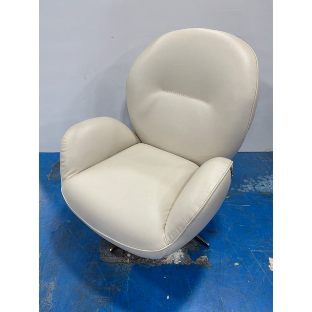 Stylish HTL Corian Italian Leather High Back Swivel Chair. Cream leather, curved body. Showroom floor sample.