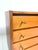 A characterful vintage sideboard from the mid-20th century with classic mid-century design, warm wood tones, and a...