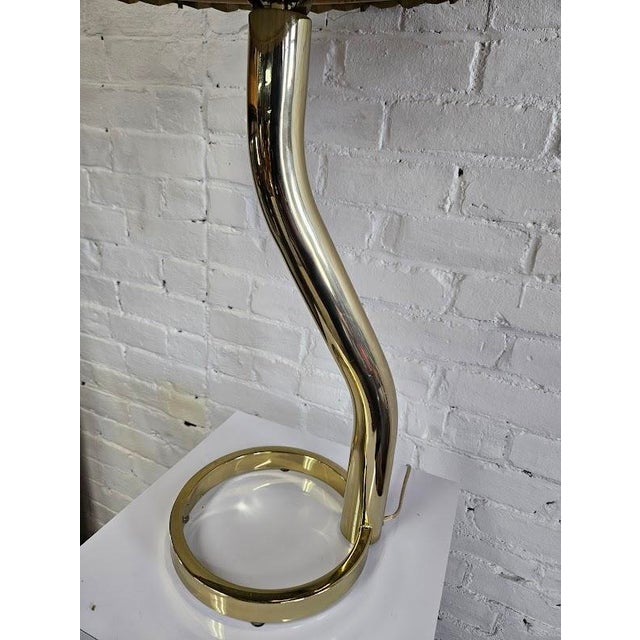 Vintage postmodern table lamp blending playful 1980s Memphis-style curves with Hollywood Regency. This lamp features a...