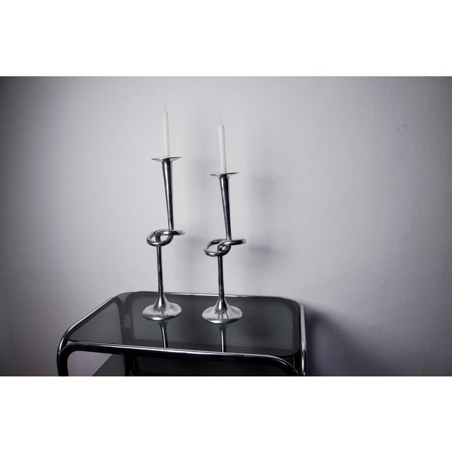 Superb and rare pair of "knot" candlesticks designed and made in Italy in the 80s. Superb metal work representing the...
