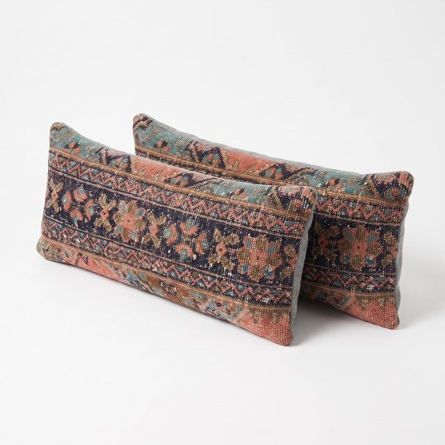 This 12'' x 35'' pillow cover set was made from authentic Turkish rug pieces — navy ground with rose and green floral...