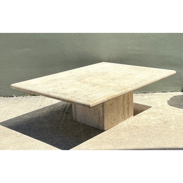 Showcasing refined Italian minimalism, this vintage mid-century coffee table is sculpted entirely from natural beige...