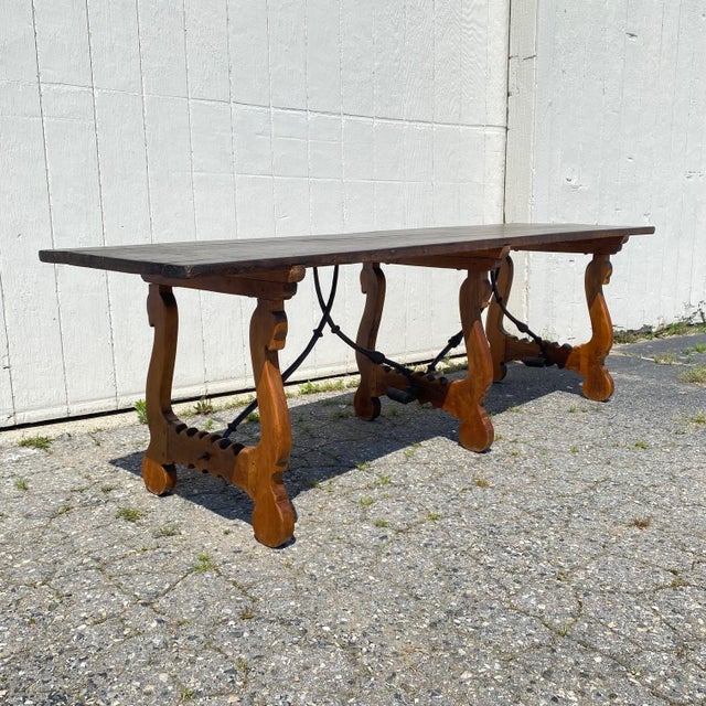 Exquisite and rare lyre leg and iron Spanish colonial solid oak plank top multipurpose table from the early 19th century...