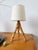 Vintage small rattan table or desk lamp from the 1960s, with its original lampshade. We love the lamp's glossy patina and...