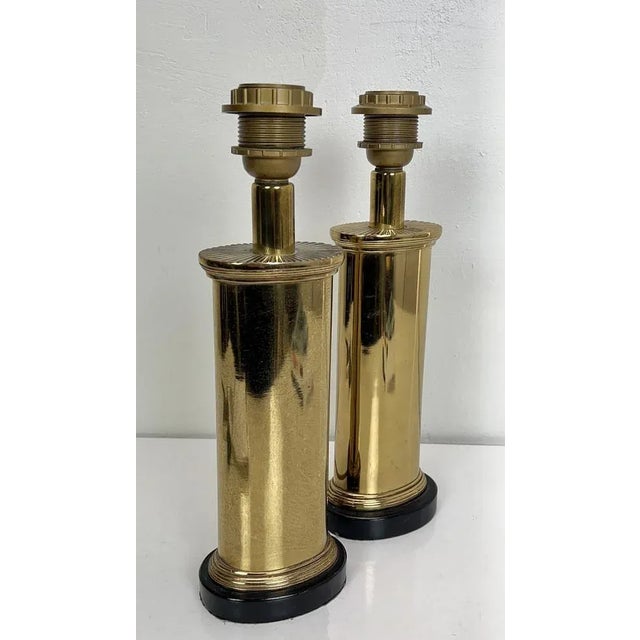 Very rare solid brass table lamps from Kullmann Netherlands. The shape of the lamps is oval, on top there is a beautiful...
