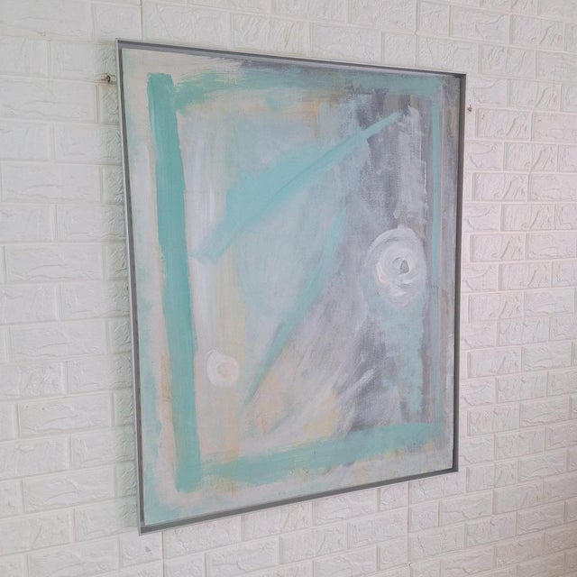Abstract painting featuring soft pastel tones, predominantly teal and gray, with swirling white accents and geometric...
