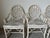This is a magnificent set of four Vintage McGuire - style "Cracked Ice" rattan and leather dining chairs. The “Cracked...