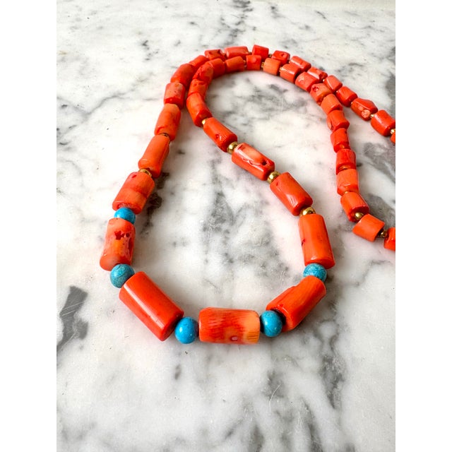 Stunning coral and turquoise branch beaded necklace with gold tone clasp. 30” long Designed by Matthew Izzo